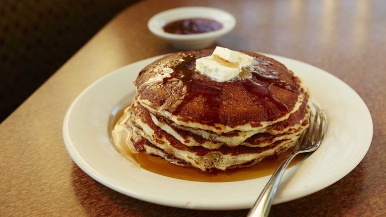 Plain pancakes topped with butter and syrup at the Plainview...