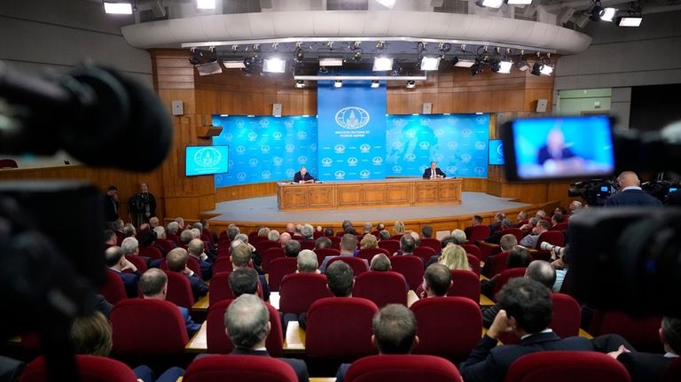 Russian President Vladimir Putin, left, and Russian Foreign Minister Sergey...