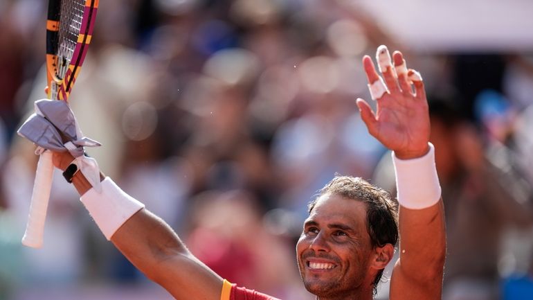 Rafael Nadal of Spain celebrates his victory over Marton Fucsovics...