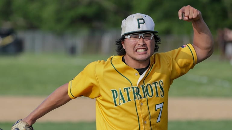 Max Nielsen of Ward Melville reacts after getting the last out...