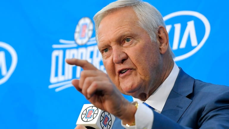 Jerry West speaks during a news conference to introduce him...