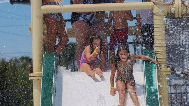 Romy Canobbio, 5, of Bay Shore, plays with her sister, Evie,...