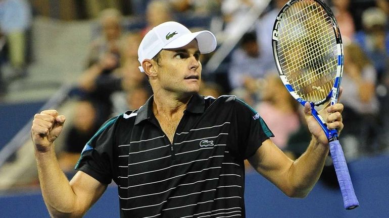 Andy Roddick celebrates after winning against fellow American Michael Russell...