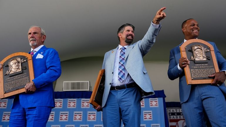 Baseball Hall of Fame inductees Jim Leyland, left, Todd Helton,...