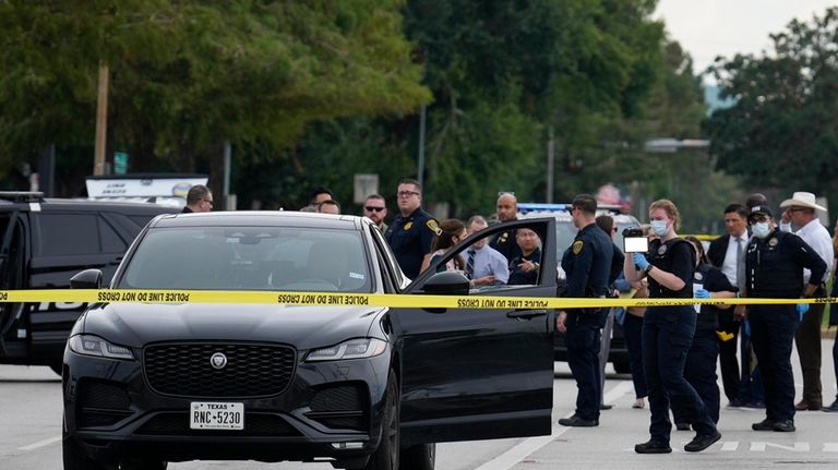 A Houston Forensic Science Center Crime Scene Unit member investigates...