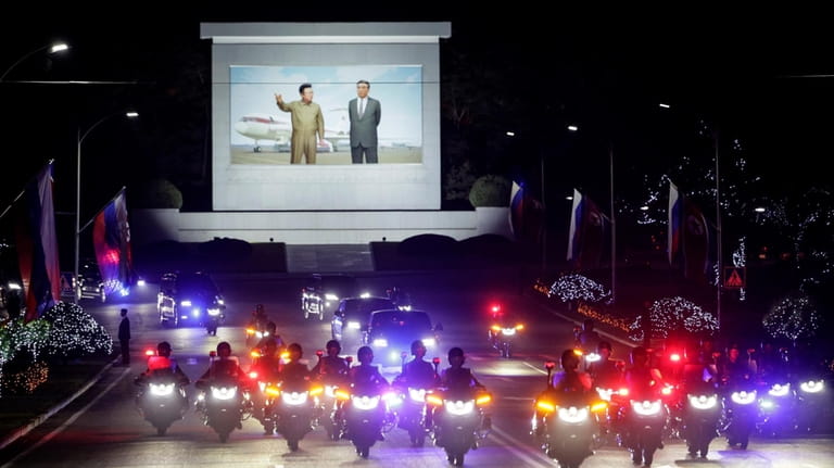 A motorcade with Russian President Vladimir Putin and North Korea's...