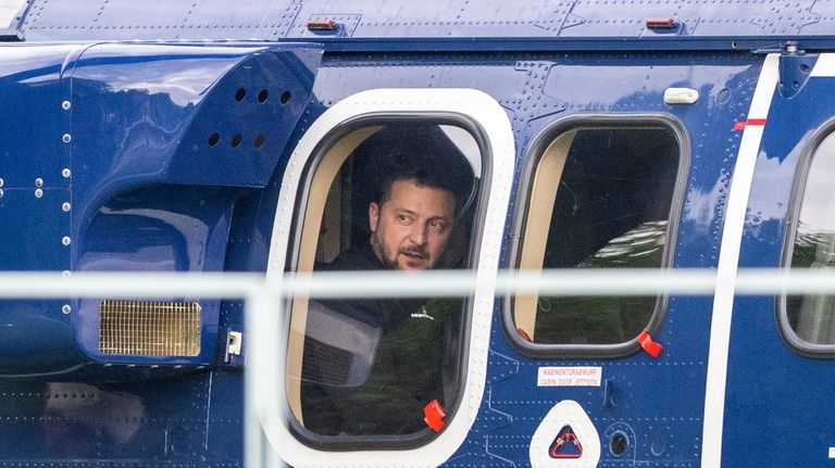 Ukrainian President Volodymyr Zelenskyy, sits in a Federal Police helicopter...