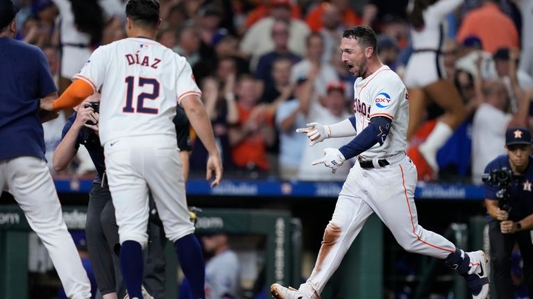 Houston Astros' Alex Bregman celebrates after hitting a walk-off home...