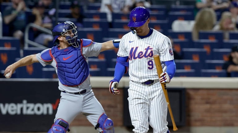 Brandon Nimmo of the Mets strikes out in the ninth inning...
