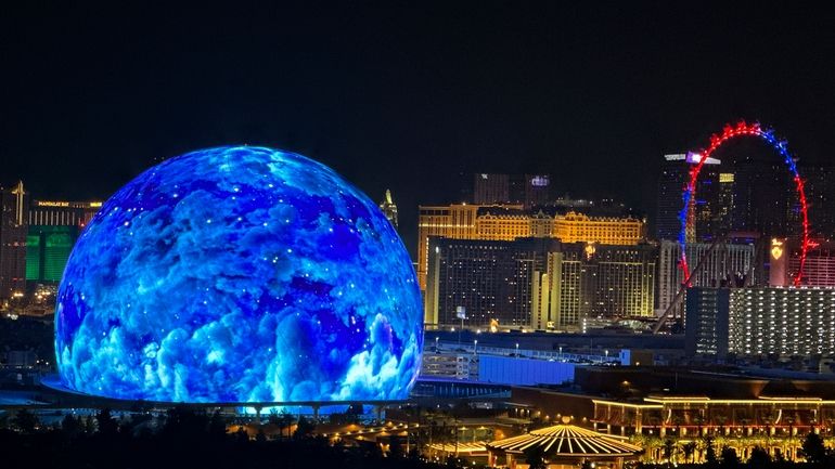 The MSG Sphere illuminates the Las Vegas skyline, as seen...