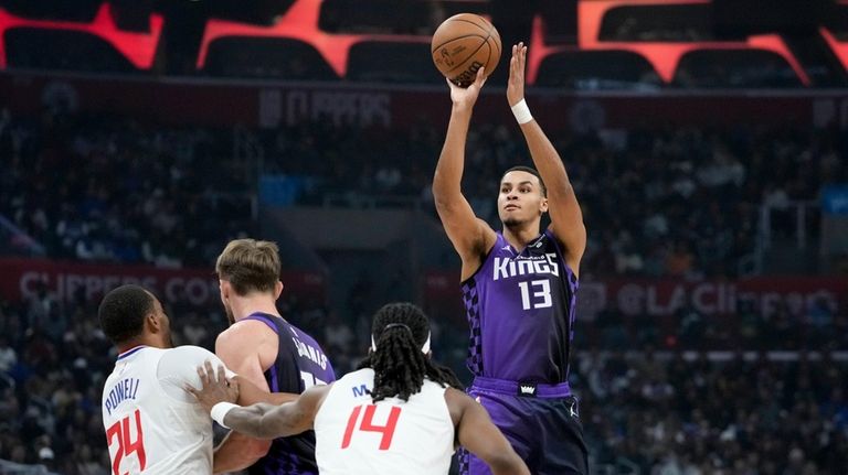 Sacramento Kings forward Keegan Murray (13) shoots against Los Angeles...