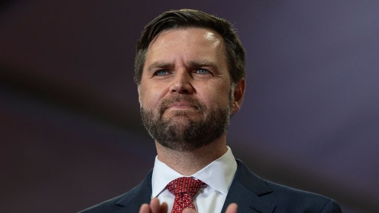 Republican vice presidential candidate Sen. JD Vance, R-Ohio, applauds while...