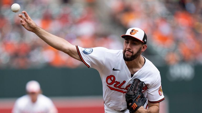 Baltimore Orioles starting pitcher Grayson Rodriguez delivers during the first...