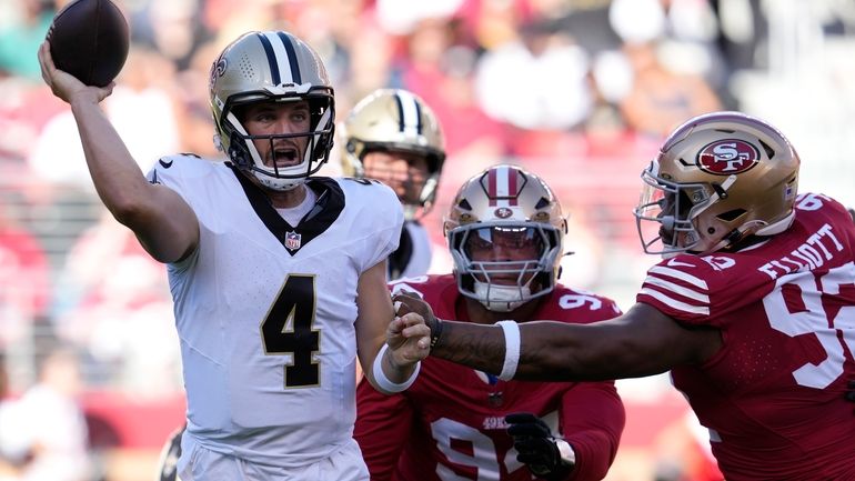 New Orleans Saints quarterback Derek Carr (4) passes as San...