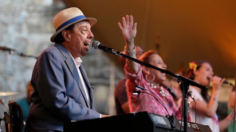 Sergio Mendes performs with his wife, Gracinha Leporace, center, at...