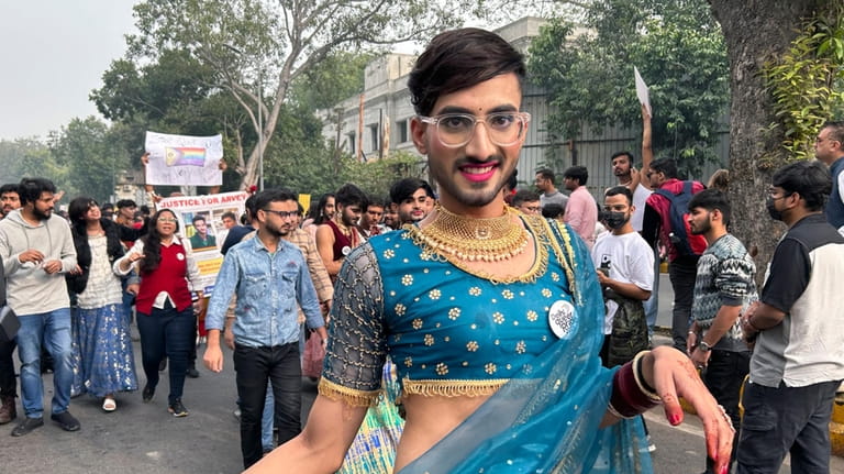 A participant of the Delhi Queer Pride Parade poses for...