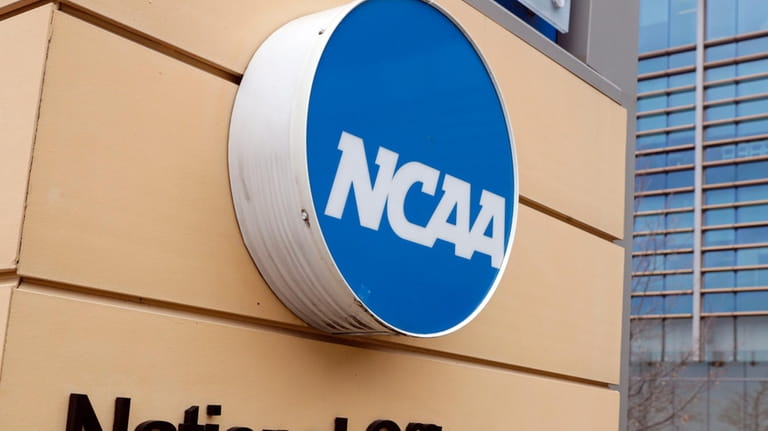 Signage is on the headquarters of the NCAA in Indianapolis,...