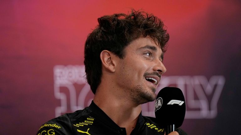 Ferrari driver Charles Leclerc of Monaco attends a news conference...