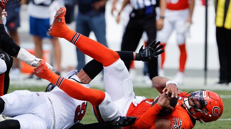 Chicago Bears quarterback Justin Fields (1) is sacked by Tampa...