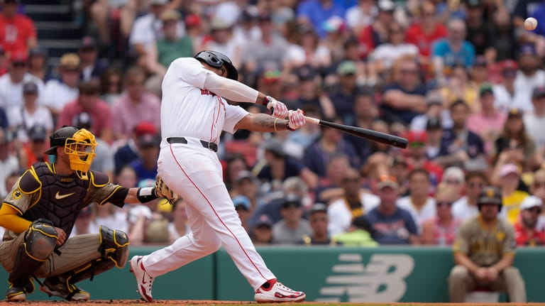 Boston Red Sox's Rafael Devers, right, hits a two-run home...