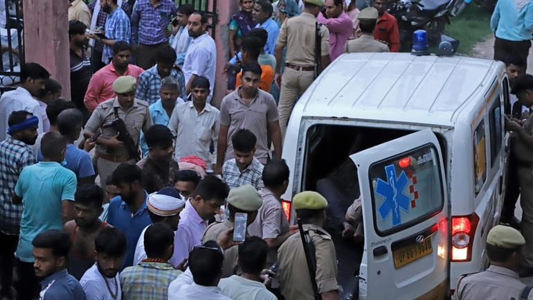 An injured arrives in an ambulance at the Sikandrarao hospital...