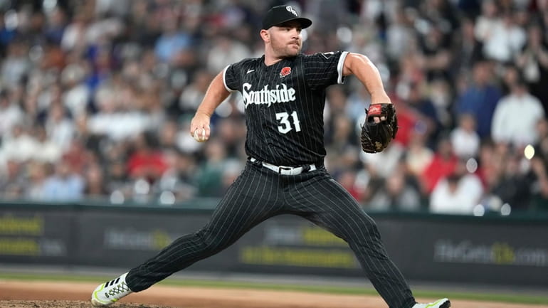 Chicago White Sox relief pitcher Liam Hendriks delivers in a...