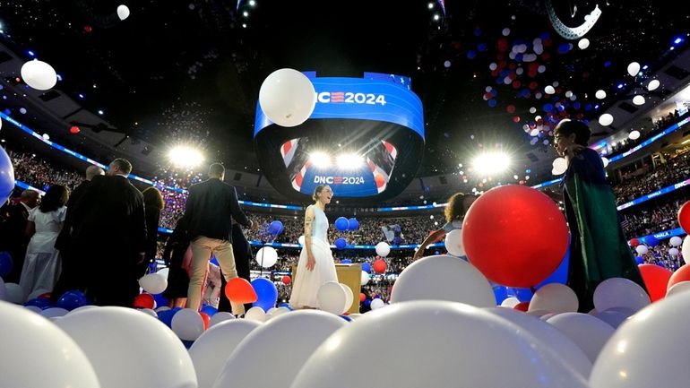 Balloons drop onto stage after Democratic presidential nominee Vice President...