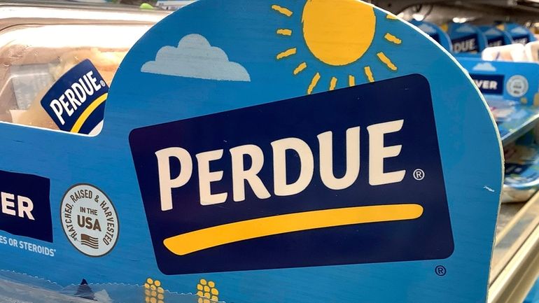 Perdue products sit in a poultry section of a supermarket...