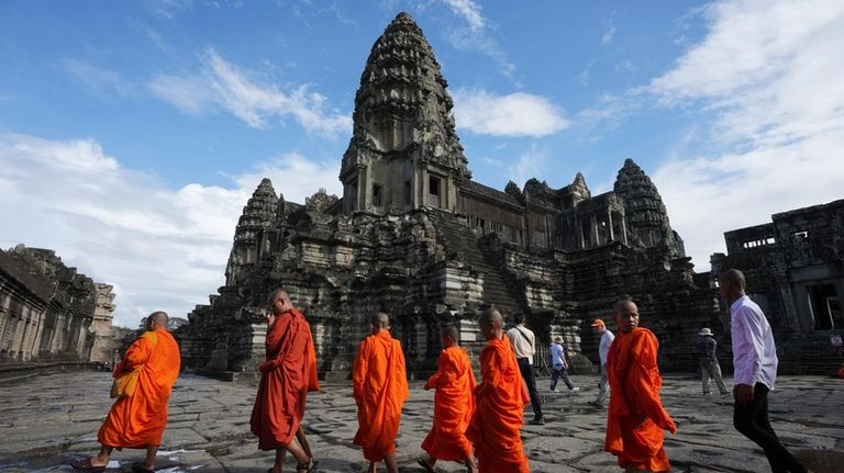 FILE -Cambodian Buddhist monks visit the Angkor Wat temple in...