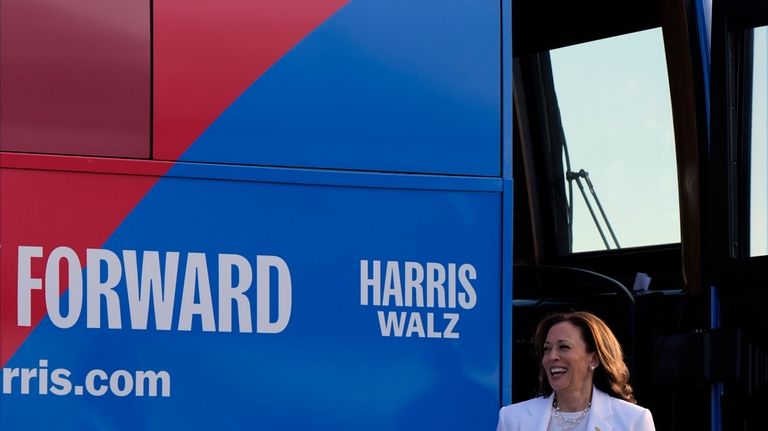 Democratic presidential nominee Vice President Kamala Harris steps off her...