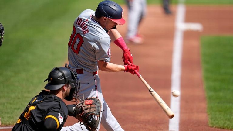 Washington Nationals' Jacob Young (30) singles off Pittsburgh Pirates starting...