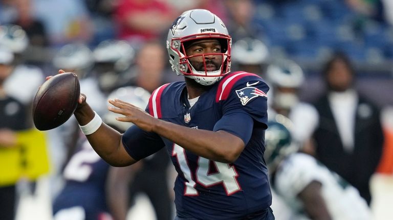 New England Patriots quarterback Jacoby Brissett passes during the first...