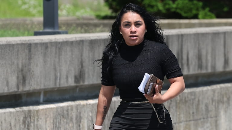 Jakeline Figueroa leaves Suffolk County Court in Riverhead on Tuesday.