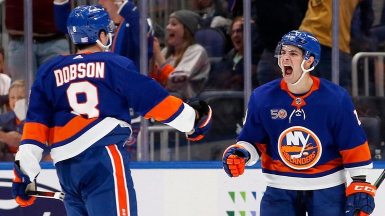 Noah Dobson of the Islanders celebrates his overtime goal against the...