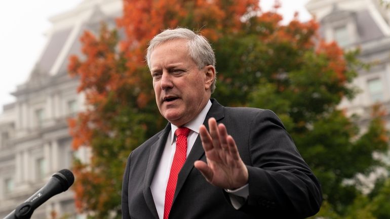 Then-White House chief of staff Mark Meadows speaks with reporters...