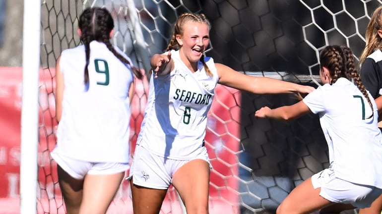Kaylie Conklin of Seaford (8) celebrates her third goal of...