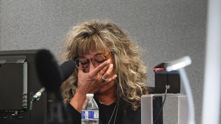 District Judge Mary Kay Holthus becomes emotional as she testifies...