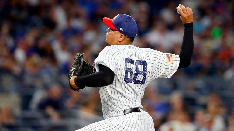 Dellin Betances #68 of the New York Yankees pitches in...