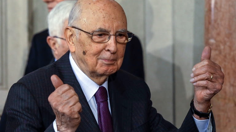 Italian President Giorgio Napolitano greets journalists after meeting with Democratic...