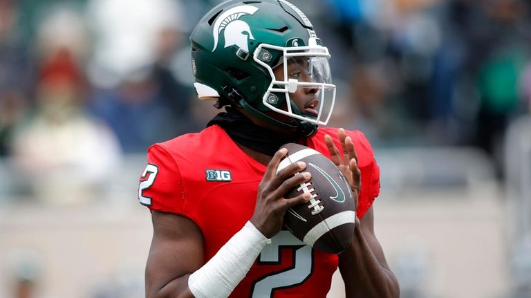 Michigan State quarterback Aidan Chiles throws during the team's NCAA...