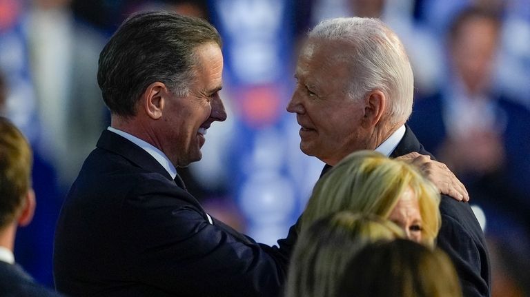 President Biden hugs his son Hunter Biden during the Democratic...