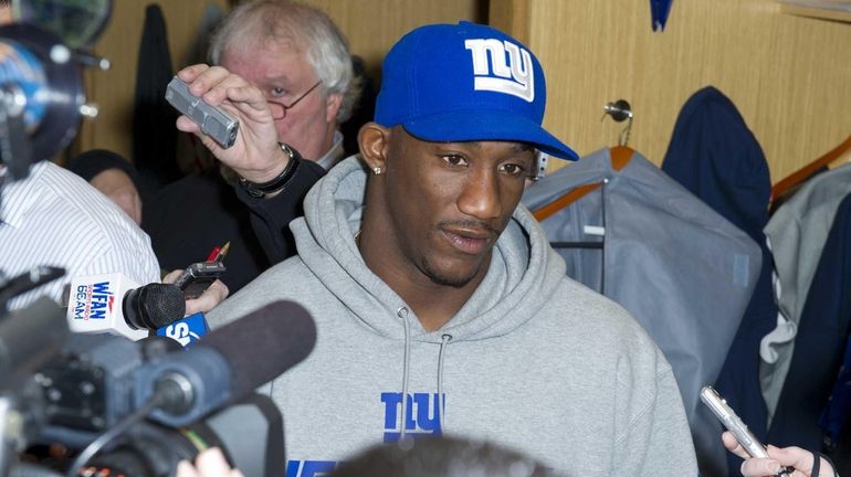 Antrel Rolle addresses the media after cleaning out his locker...