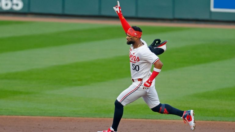 Minnesota Twins' Willi Castro runs the bases on his three-run...