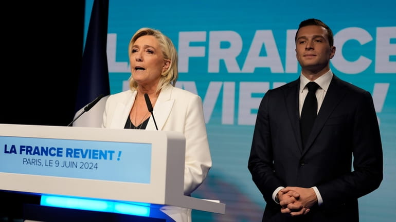 French far-right leader Marine Le Pen delivers a speech as...