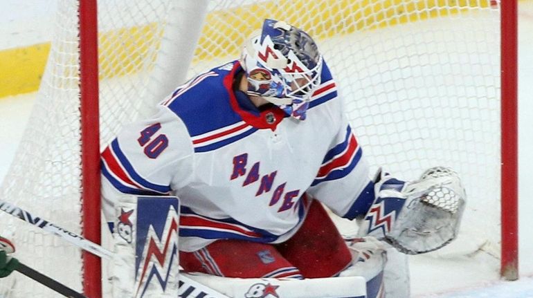 Rangers goalie Alexandar Georgiev stops a shot during the first...