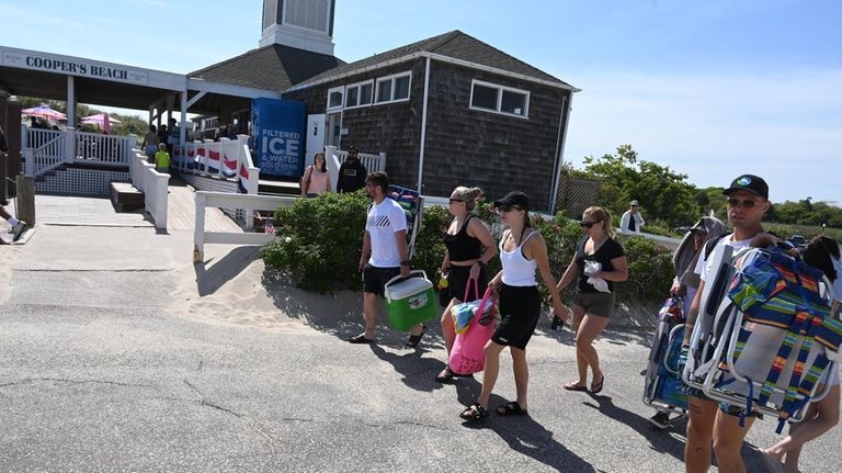 People head to Coopers Beach for fun in the sun.