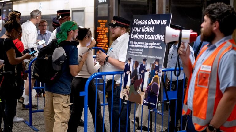 Long Island Rail Road passengers have their tickets prechecked before...