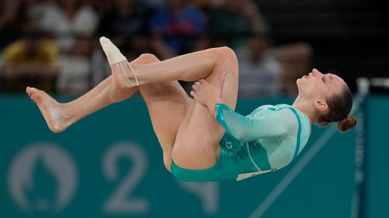 Ana Barbosu, of Romania, competes during the women's artistic gymnastics...