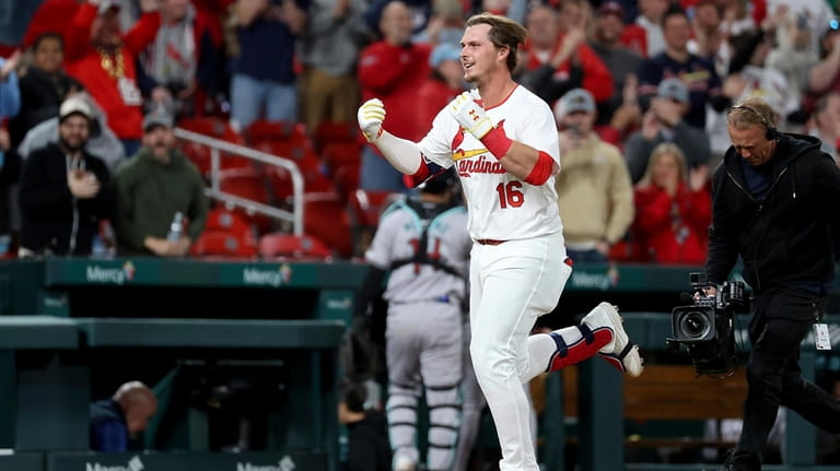 St. Louis Cardinals' Nolan Gorman celebrates as he runs the...