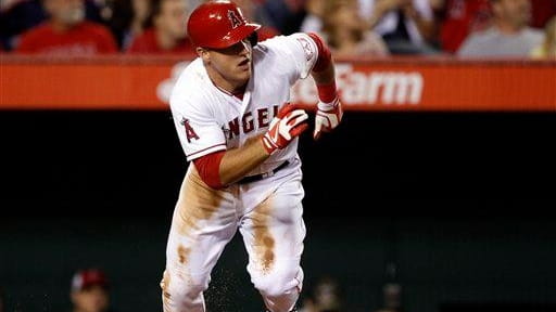 Los Angeles Angels outfielder Mike Trout races from home, as...